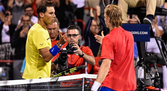 Rafael Nadal in handshake with Denis Shapovalov